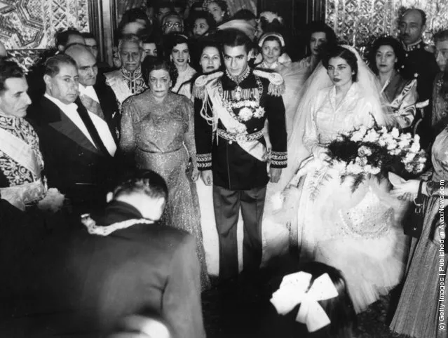 1951:  Muhammad Reza Shah Pahlavi (1919 - 1980), the Shah of Iran, at his wedding flanked by his bride and mother