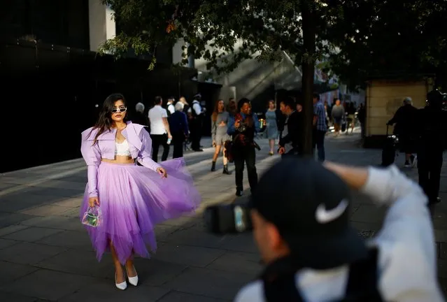 A photographer takes a photo outside of a venue at London Fashion Week in London, Britain, September 17, 2019. (Photo by Henry Nicholls/Reuters)