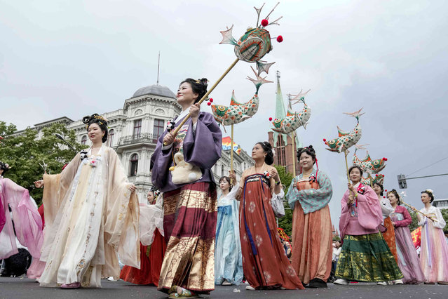 Dancers representing China perform at the annual Carnival of Cultures parade in Berlin, central Germany, Sunday, May 19, 2024. Thousands of people attend the festival with costumes from all over the world. (Photo by Ebrahim Noroozi/AP Photo)