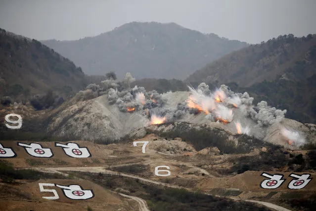 Explosions are seen at a target, during a U.S.-South Korea joint live-fire military exercise, at a training field, near the demilitarized zone, separating the two Koreas in Pocheon, South Korea April 21, 2017. (Photo by Kim Hong-Ji/Reuters)