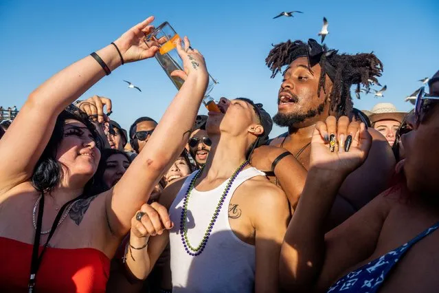 College students party at the beach during the South Padre Spring Break tradition on March 16, 2022 in South Padre Island, Texas. The South Texas island is one of the top Spring Break destinations in Texas and attracts students from all over the country. (Photo by Brandon Bell/Getty Images)