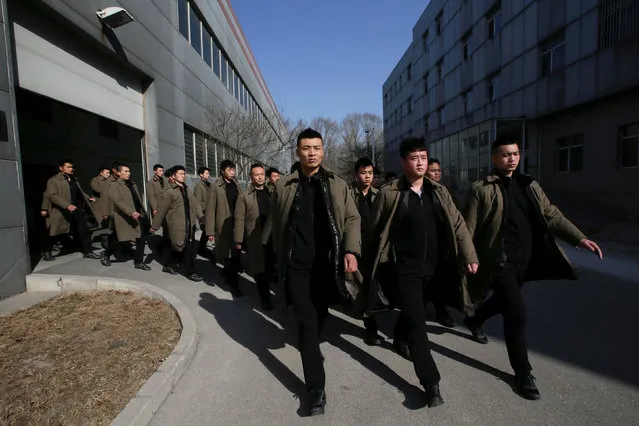 Trainees from Dewei Security walk for a daily training session at a training camp, on the outskirts of Beijing, China March 2, 2017. (Photo by Jason Lee/Reuters)