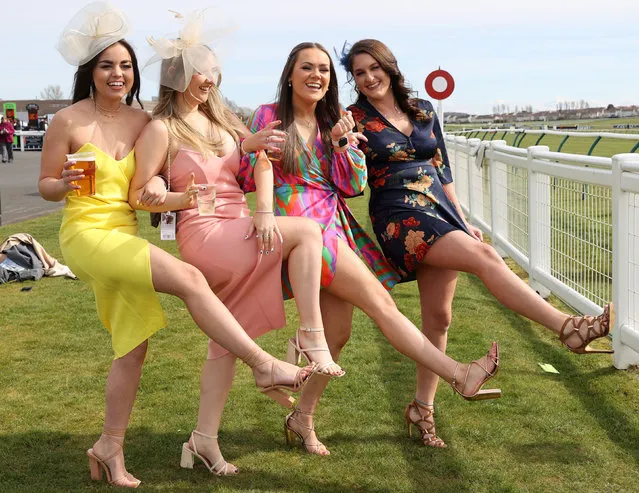 Racegoers pose for a photo during the Coral Scottish Grand National Ladies Day at Ayr Racecourse, Ayr, United Kingdom on Friday, April 1, 2022. (Photo by Steve Welsh/PA Images via Getty Images)