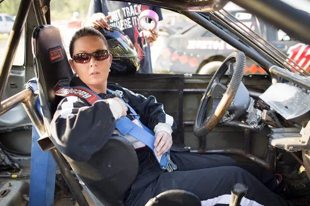 In this July 17, 2015 photo, Stacey Harrison prepares for a qualifying round at the start of dirt track racing at the Ponderosa Speedway in Junction City, Ky. Harrison races in the Four Cylinder division with the help of her husband and sons and finished in fourth place in her division's featured race. (Photo by David Stephenson/AP Photo)