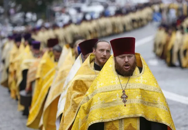 Clergymen take part in a ceremony marking the 1,000th anniversary of the death of Vladimir the Great in Kiev, Ukraine, July 27, 2015. (Photo by Valentyn Ogirenko/Reuters)