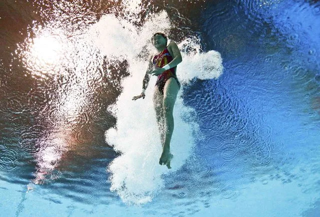 China's Ren Qian is seen underwater during the women's 10m platform preliminary event at the Aquatics World Championships in Kazan, Russia July 29, 2015. (Photo by Stefan Wermuth/Reuters)