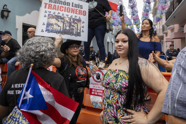 People protest in San Juan, Puerto Rico, Wednesday, June 28, 2023. Hundreds of people including religious leaders, economists, lawyers, teachers and retirees protested a proposed increase to already high electric bills that a growing number of people in the U.S. territory are struggling to pay. (Photo by Alejandro Granadillo/AP Photo)