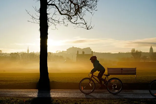 Sunrise in Inverleith Park, with a view of Edinburgh Castle in Edinburgh, England on December 25, 2019. (Photo by Craig Brown/Alamy Live News)