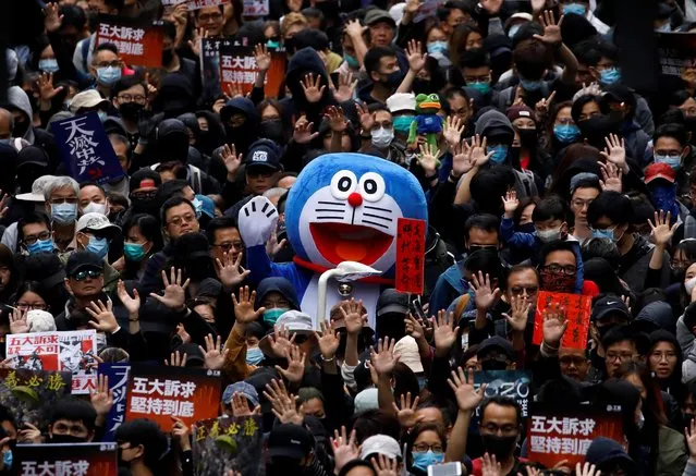 A person dressed in a costume of anime character Doraemon attends an anti-government demonstration on New Year's Day to call for better governance and democratic reforms in Hong Kong, China, January 1, 2020. (Photo by Navesh Chitrakar/Reuters)