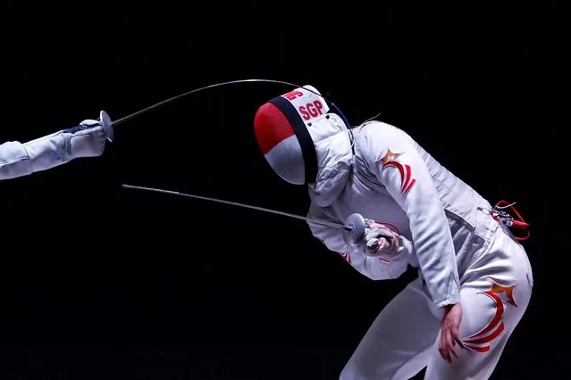 Singapore's Jonathan Tian Wei Au Eong in action against Malaysia's Hans Wei Shen Yoon during the Men's Foil Individual semi final at the Southeast Asian Games in Hanoi, Vietnam on May 15, 2022. (Photo by Navesh Chitrakar/Reuters)