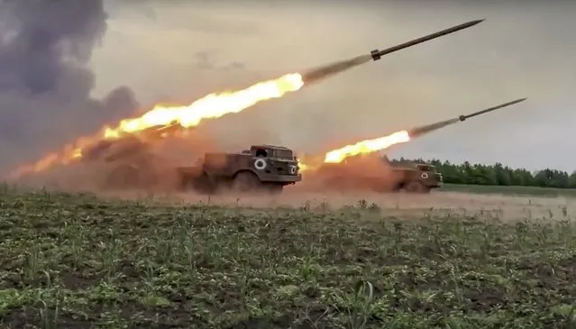 In this handout photo released by Russian Defense Ministry Press Service released on Wednesday, June 1, 2022, The Russian military's Uragan multiple rocket launchers fire rockets at Ukrainian troops at an undisclosed location. (Photo by Russian Defense Ministry Press Service via AP Photo)
