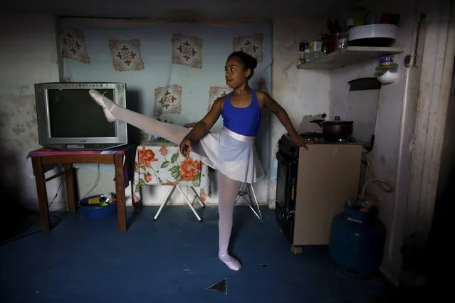 Taissa Lima, 10, practices in her house before her ballet lesson at the New Dreams dance studio, in the Luz neighborhood known to locals as Cracolandia (Crackland) in Sao Paulo, Brazil, August 12, 2015. (Photo by Nacho Doce/Reuters)