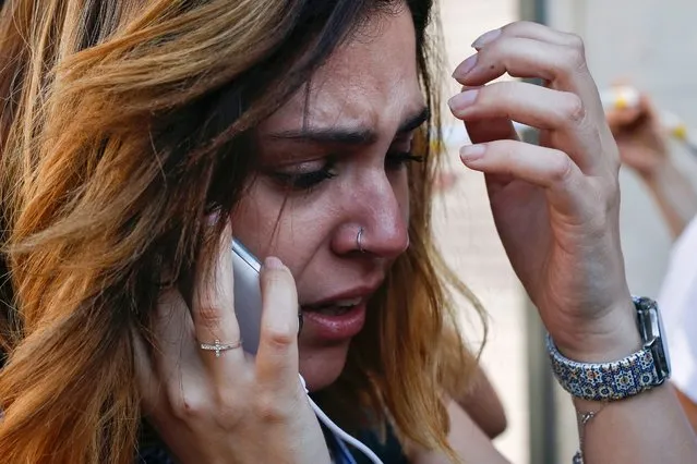 A woman cries as she phones after a van ploughed into the crowd, killing one person and injuring several others on the Rambla in Barcelona on August 17, 2017. Police in Barcelona said they were dealing with a “terrorist attack” after a vehicle ploughed into a crowd of pedestrians on the city's famous Las Ramblas boulevard on August 17, 2017. Police were clearing the area after the incident, which has left a number of people injured. (Photo by Pau Barrena/AFP Photo)