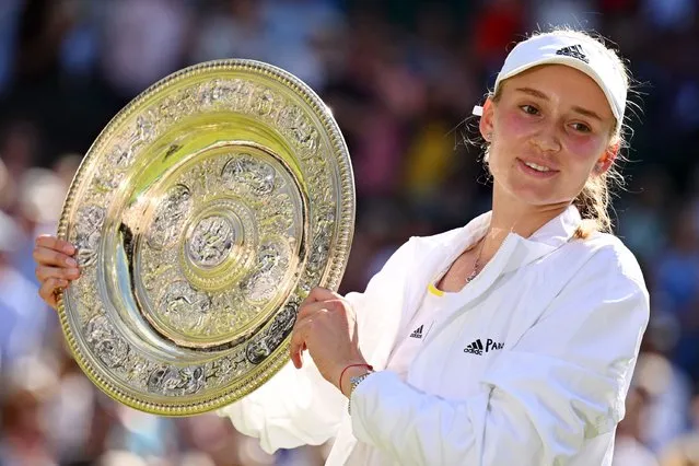 Kazakhstan's Elena Rybakina celebrates with the Venus Rosewater Dish trophy during the podium ceremony after winning the women's singles final tennis match against Tunisia's Ons Jabeur on the thirteenth day of the 2022 Wimbledon Championships at The All England Tennis Club in Wimbledon, southwest London, on July 9, 2022. (Photo by Sebastien Bozon/AFP Photo)