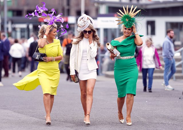 Racegoers Tracy Mcguinness, Clara Mcguinness and Carinna Hynes (left-right) during day one of the Galway Races Summer Festival 2022 at Galway Racecourse in County Galway, Republic of Ireland on Monday, July 25, 2022. (Photo by Niall Carson/PA Images via Getty Images)