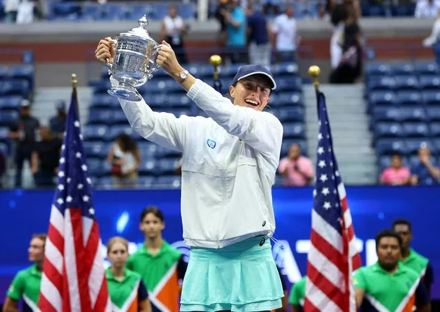 Iga Swiatek of Poland holds the trophy after victory in final of US Open Championships against Ons Jabeur of Tunisia at USTA Billie Jean King National Tennis Center in New York on September 10, 2022. Swiatek won in straight sets. It was her second Grand Slam victory in this year and first ever for Polish woman. (Photo by Mike Segar/Reuters)