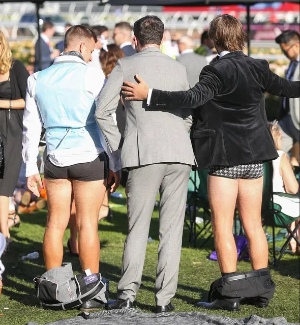 A group of lads drop their trousers as they stand in the middle of a crowd on 2017 Derby Day at Flemington Racecourse on November 4, 2017 in Melbourne, Australia. (Photo by Splash News and Pictures)