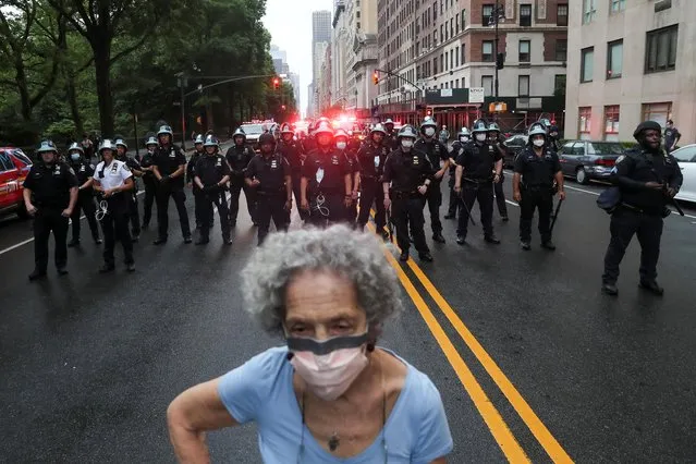 Police officers stand guard during a protest against the death in Minneapolis police custody of George Floyd, in New York City, New York, U.S., June 5, 2020. (Photo by Jeenah Moon/Reuters)
