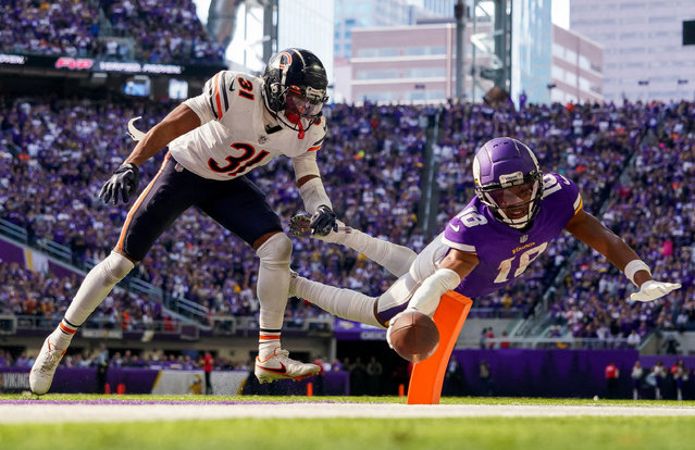 Minnesota Vikings wide receiver Justin Jefferson (18) dives for a two-point conversion against the Chicago Bears cornerback Jaylon Jones (31) in the fourth quarter at U.S. Bank Stadium in Minneapolis, Minnesota on October 9, 2022. (Photo by Brad Rempel/USA TODAY Sports)