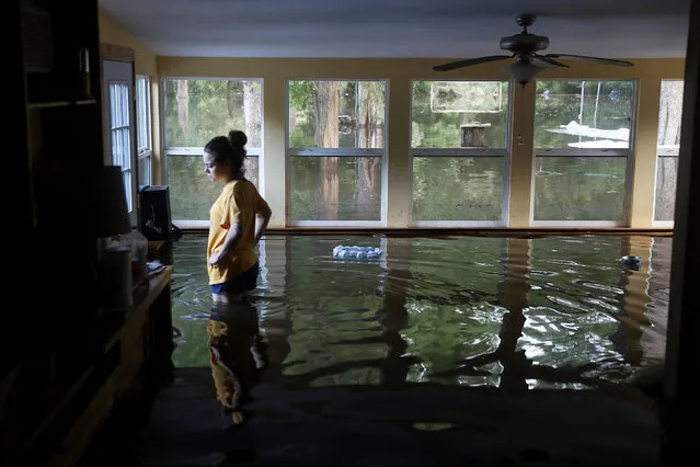 Leslie Andermann Gallagher surveys the flood damage to her home on August 17, 2016 in Sorrento, Louisiana. Last week Louisiana was overwhelmed with flood water causing at least twelve deaths and thousands of homes damaged by the flood waters. (Photo by Joe Raedle/Getty Images)