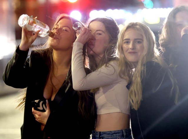 Three partygoers lapping up the nightlife on Duncan Street in Leeds, United Kingdom on June 6, 2024. (Photo by NB Press LTD)