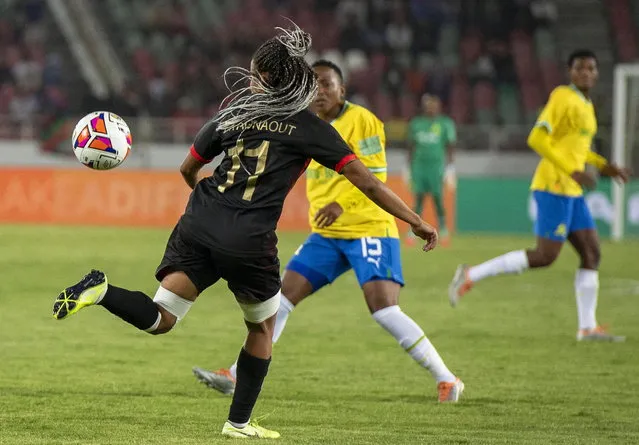 Fatima Tagnaout (L) of Rabat in action against Lerato Kgasago (C) of Mamelodi Sundowns during the CAF Women's Champions League final between FAR Rabat and Mamelodi Sundowns in Rabat, Morocco, 13 November 2022. (Photo by Jalal Morchidi/EPA/EFE)
