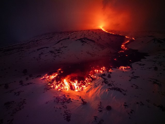Lava flows from a fracture on Italy’s Mount Etna on Friday, February 14, 2025. A week of spectacular lava sprays on Mount Etna, one of the world’s most active volcanos, has drawn thousands of people wanting to see the eruption. (Phoot by Etna Walk via AFP Photo)