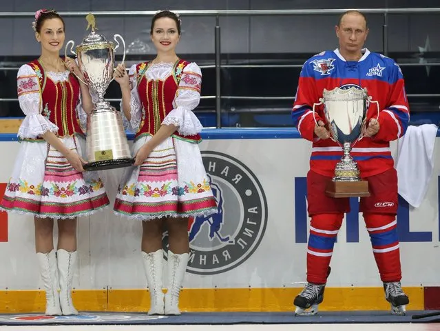  Russian President Vladimir Putin attends a Night Hockey League ice hockey match on October 7, 2015 in Sochi, Russia. Putin spent his 63rd birthday playing hockey with NHL stars. (Photo by Sasha Mordovets/Getty Images)