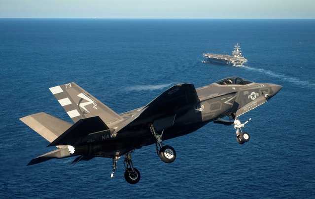 This Monday, November 3, 2014 photo provided by the US Navy shows an F-35C Joint Strike Fighter conducts an approach on the aircraft carrier USS Nimitz, 40 miles off San Diego, Calif. The Navy has completed the first two landings of F-35C Joint Strike Fighters a milestone for the new plane. (Photo by Andy Wolfe/AP Photo/U.S. Navy)