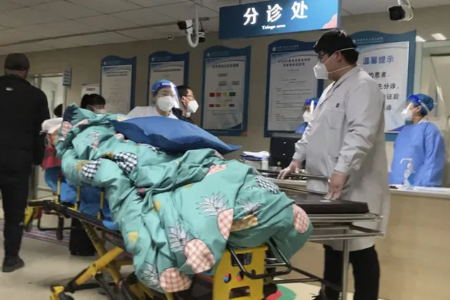 A patient is turned away from the emergency room due to full capacity at the Baoding No. 2 Central Hospital in Zhuozhou city in northern China's Hebei province on Wednesday, December 21, 2022. China only counts deaths from pneumonia or respiratory failure in its official COVID-19 death toll, a Chinese health official said, in a narrow definition that limits the number of deaths reported, as an outbreak of the virus surges following the easing of pandemic-related restrictions. (Photo by Dake Kang/AP Photo)