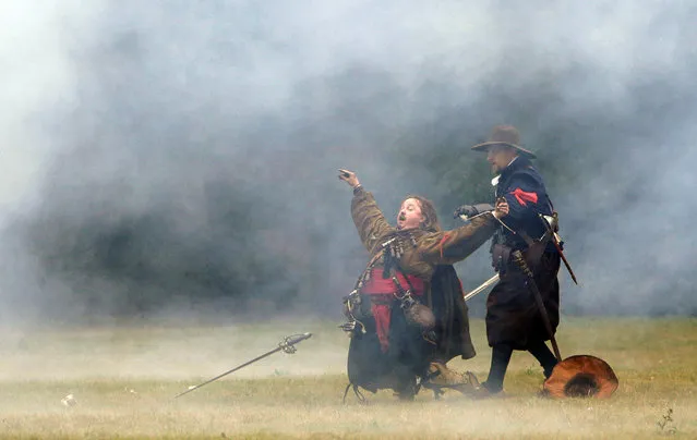 Participants wearing medieval costumes re-enact the 1620 battle of Bila Hora between Bohemian Estates and Austrian Imperial with Catholic forces in Prague, Czech Republic September 18, 2016. (Photo by David W. Cerny/Reuters)