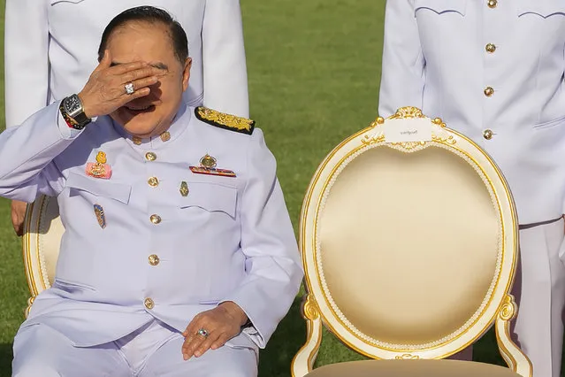Thailand's Deputy Prime Minister and Defence Minister Prawit Wongsuwan shields his eyes from the sun and displays a watch he is wearing during a photo session at the Government House in Bangkok, Thailand on February 5, 2018. (Photo by Reuters/Stringer)