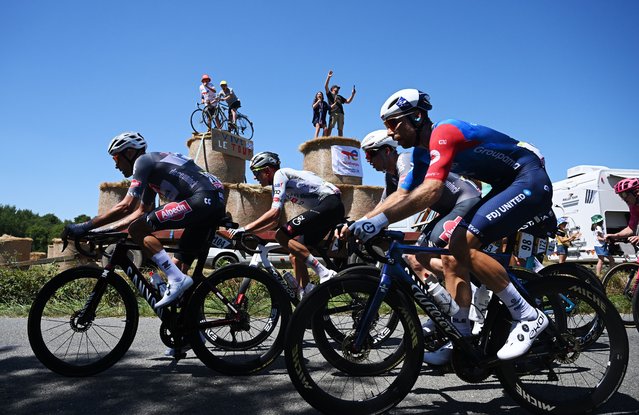 (L-R) Xandro Meurisse of Belgium and Team Alpecin - Deceuninck and Clement Russo of France and Team Groupama - FDJ compete while fans cheer during the 112th Tour de France, Stage 7 a 197km stage from Saint-Malo to Mur-de-Bretagne (Guerledan) / #UCIWT / on July 11, 2025 in Saint-Malo, France. (Photo by Dario Belingheri/Getty Images)