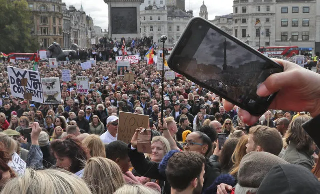People take part in a “We Do Not Consent” rally at Trafalgar Square, organised by Stop New Normal, to protest against coronavirus restrictions, in London, Saturday, September 26, 2020. (Photo by Frank Augstein/AP Photo)