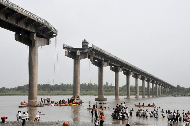 Rescuers search for survivors after a bridge collapsed in Vadodara in the western state of Gujarat, India, on July 9, 2025. (Photo by Reuters/Stringer)