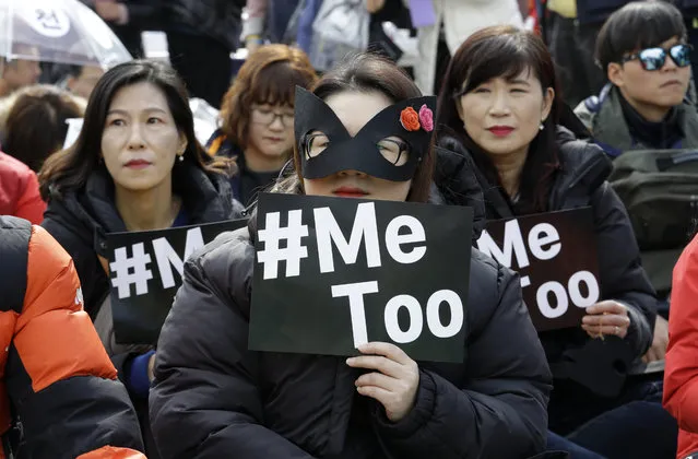 Female workers supporting the MeToo movement wearing black attend a rally to mark the International Women's Day in Seoul, South Korea, Thursday, March 8, 2018. (Photo by Ahn Young-joon/AP Photo)
