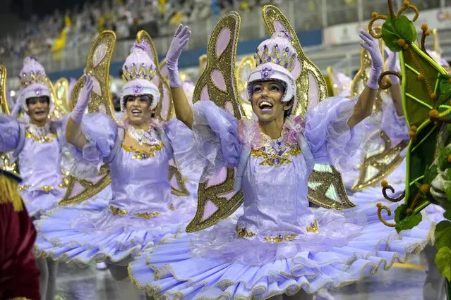 Dancers from the Aguia de Ouro samba school perform during a carnival parade in Sao Paulo, Brazil, Sunday, February 19, 2023. (Photo by Andre Penner/AP Photo)