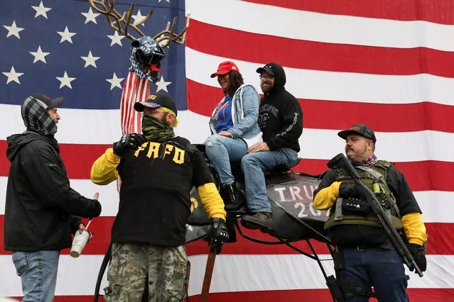 Supporters of U.S. President Donald Trump sit on the “Patriot Elk” formerly known as the “Nightmare NElk” during “Stop the Steal” protest after the 2020 U.S. presidential election was called for Democratic candidate Joe Biden in Salem, Oregon, U.S., November 14, 2020. (Photo by Alisha Jucevic/Reuters)