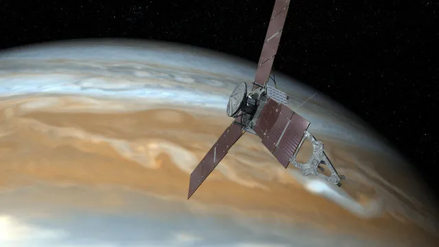This undated artist's rendering shows NASA's Juno spacecraft making one of its close passes over Jupiter. NASA said Wednesday, October 19, 2016, that the Juno spacecraft circling Jupiter went into safe mode, turning off its camera and instruments. The space agency said the Juno craft is healthy as engineers try to figure out what went wrong. (Photo by NASA via AP Photo)