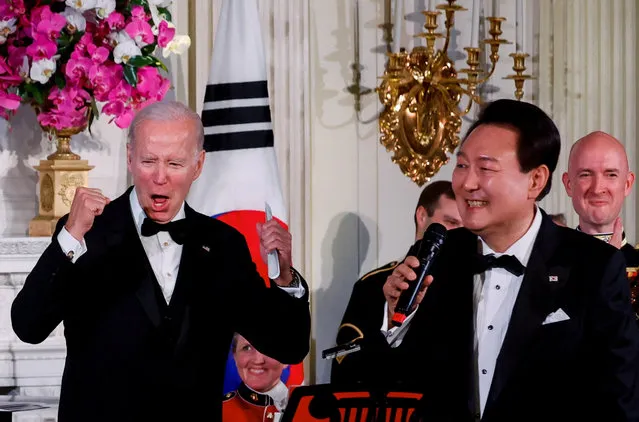 U.S. President Joe Biden reacts as South Korea's President Yoon Suk Yeol sings at an official State Dinner, during Yoon Suk Yeol's visit, at the White House in Washington, U.S. April 26, 2023. (Photo by Evelyn Hockstein/Reuters)