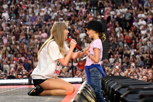 American singer-songwriter Taylor Swift speaks to a kid onstage during “Taylor Swift | The Eras Tour” at Johan Cruijff Arena on July 04, 2024 in Amsterdam, Netherlands. (Photo by Carlos Alvarez/Getty Images for TAS Rights Management)