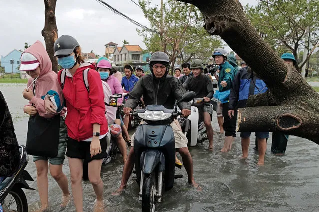 Local people commute in the aftermath of Typhoon Molave, in Hoi An, Quang Nam province, Vietnam, 28 October 2020. Molave made landfall on 28 October in Quang Ngai province, approximately 100 kilometers south of Hoi An. (Photo by EPA/EFE/Stringer)