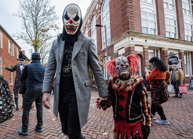 Costumed revelers, dressed as evil clowns, celebrate Halloween Eve in Salem, Massachusetts, on October 30, 2024. (Photo by Joseph Prezioso/AFP Photo)