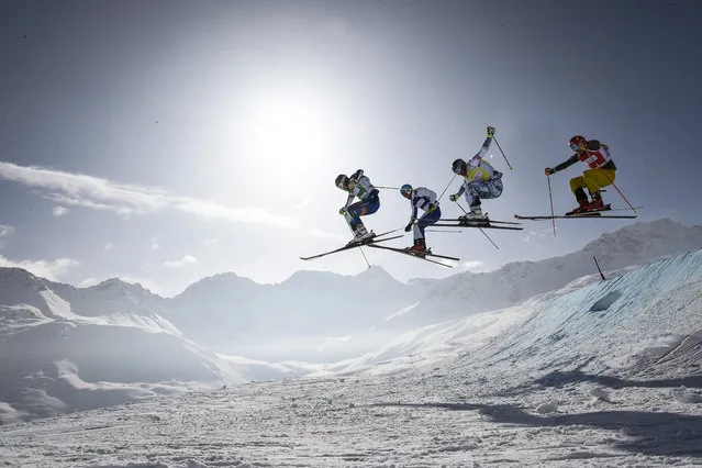(L-R) Victor Oehling Norberg of Sweden, Sergey Ridzik of Russia, Bastien Midol of France, and Daniel Bohnacker of Germany in action during the final race of the men's Ski Cross event at the Freestyle Skiing World Cup in Arosa, Switzerland, February 6, 2015. Oehling Norberg won ahead of second placed Ridzik and third placed Midol. (Photo by Gian Ehrenzeller/EPA)