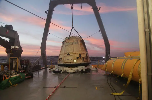This Tuesday, February 10, 2015 photo made available by SpaceX shows their Dragon capsule aboard a ship in the Pacific Ocean west of Mexico's Baja Peninsula after returning from the International Space Station, carrying about 3,700 lbs of cargo for NASA. (Photo by AP Photo/SpaceX)