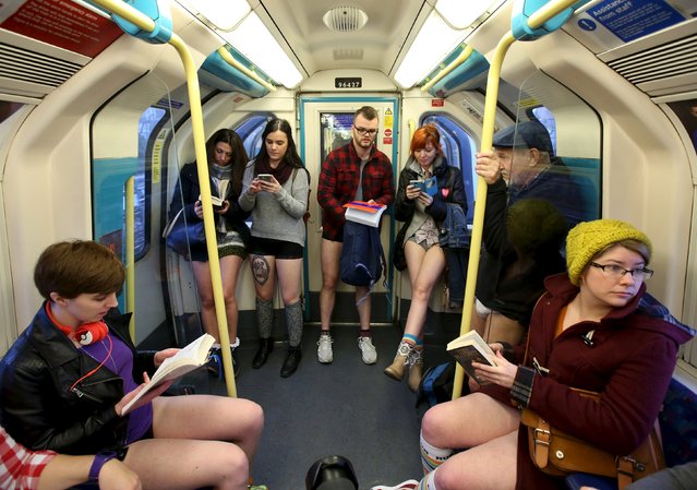 Participants in the annual No Trousers On The Tube Day ride the London Underground in London, Britain January 10, 2016. (Photo by Paul Hackett/Reuters)