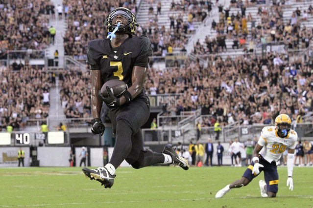 Central Florida wide receiver Xavier Townsend (3) celebrates after scoring a 9-yard touchdown after catching a pass in front of Kent State defensive back Jalani Williams (29) during the first half of an NCAA college football game, Thursday, August 31, 2023, in Orlando, Fla. (Photo by Phelan M. Ebenhack/AP Photo)