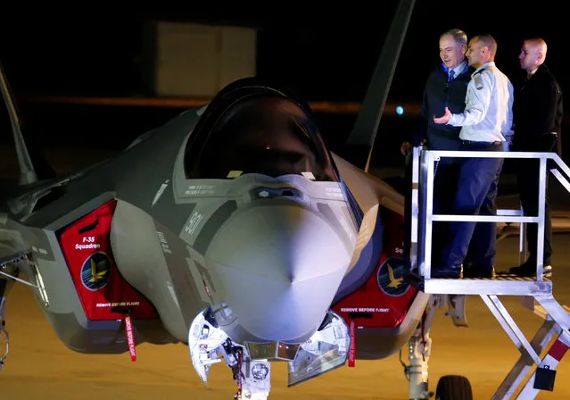 Israeli Prime Minister Benjamin Netanyahu stands next to a F-35 fighter jet just after it landed in Israel at Nevatim air base after the Israeli air force bought them at Nevatim in southern Israel December 12, 2016. (Photo by Amir Cohen/Reuters)