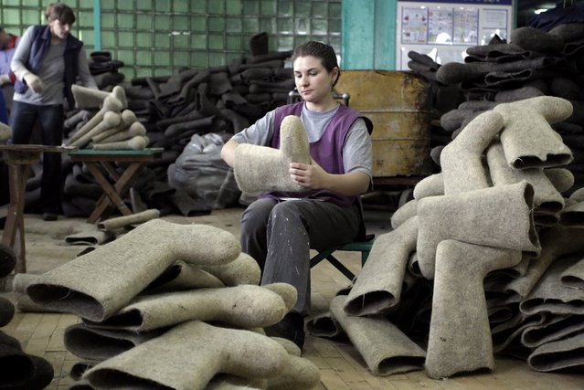 Belarusian workers works at a felt boot factory in Smilovichi, some 35km from Minsk, Belarus, 16 January 2012. (Photo by Tatyana Zenkovich/EPA)