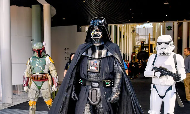 People dress as the Star Wars characters (from left) Boba Fett, Darth Vader and a stormtrooper for an exhibition preview at Powerhouse Museum in Sydney, Australia on November 15, 2018. (Photo by Brendan Esposito/AAP Image)